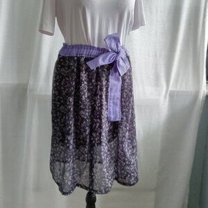 Pretty hand made floral silk skirt on a black background